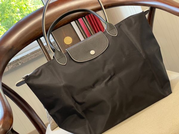 the tote bag women totes bag nylon designers bags fashion all-match classic womens street trend large capacity handbags
the tote bag women totes bag nylon designers bags fashion all-match classic womens street trend large capacity handbags