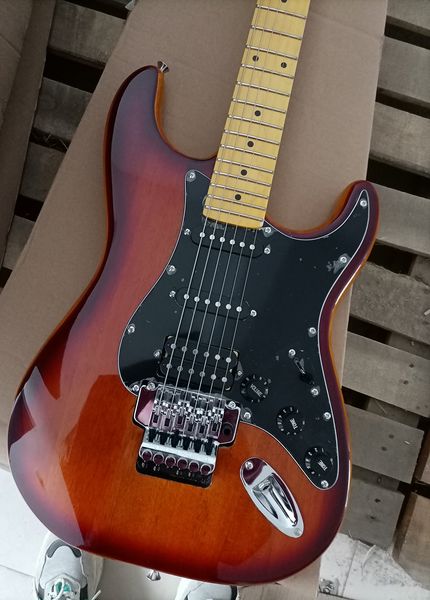 6 strings brown electric guitar with tremolo bar maple fretboard