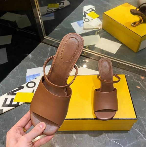 first black leather high-heeled sandals with wide band and strap made of leather diagonal f-shaped sculpted heel in gold-coloured metal mult
first black leather high-heeled sandals with wide band and strap made of leather diagonal f-shaped sculpted heel in gold-coloured metal mult