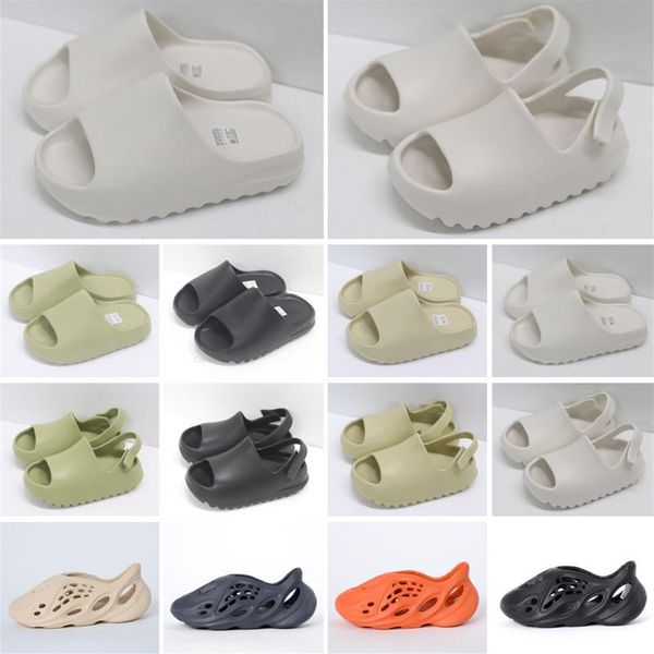 2021 fashion eva foam runner kan slides toddlers infants kids childrens slippers triple red white black desert sand bone resin san2324
2021 fashion eva foam runner kan slides toddlers infants kids childrens slippers triple red white black desert sand bone resin san2324