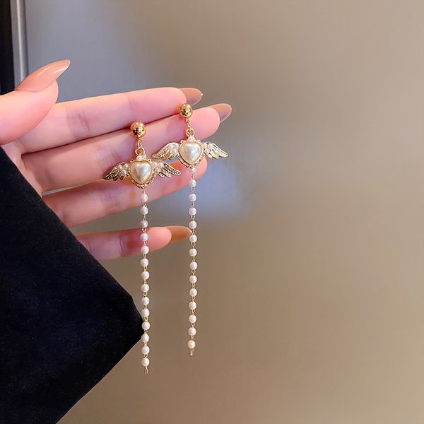 925 silver needle pearl heart wings tassel earrings female korean temperament girly and fashion earrings face slimming eardrop, Golden
925 silver needle pearl heart wings tassel earrings female korean temperament girly and fashion earrings face slimming eardrop, Golden