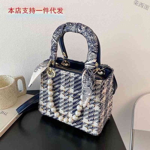minority design female spring and summer new fashion pearl chain portable single shoulder cross messenger princess bag luxury designer
minority design female spring and summer new fashion pearl chain portable single shoulder cross messenger princess bag luxury designer