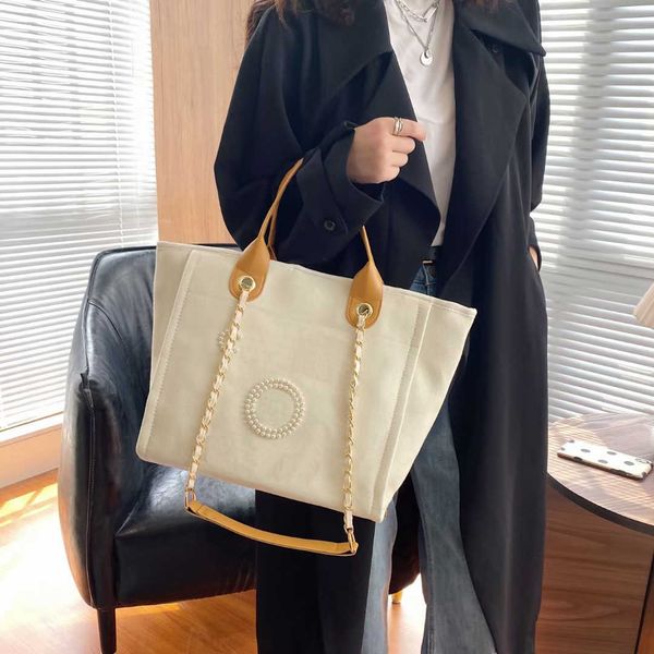 luxury high-capacity one-shoulders tote bags fashion canvas pearl handbags beige black leather chain ladies document office travel beach
luxury high-capacity one-shoulders tote bags fashion canvas pearl handbags beige black leather chain ladies document office travel beach
