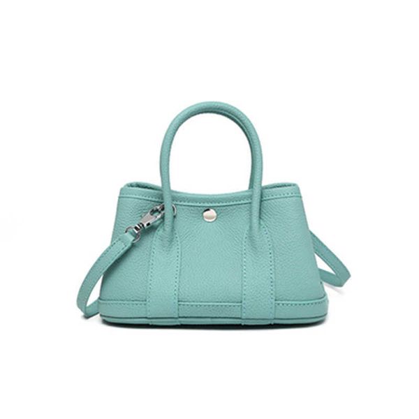 new mini cowhide mini pastoral large-capacity bucket bag s portable tote bag 
new mini cowhide mini pastoral large-capacity bucket bag s portable tote bag