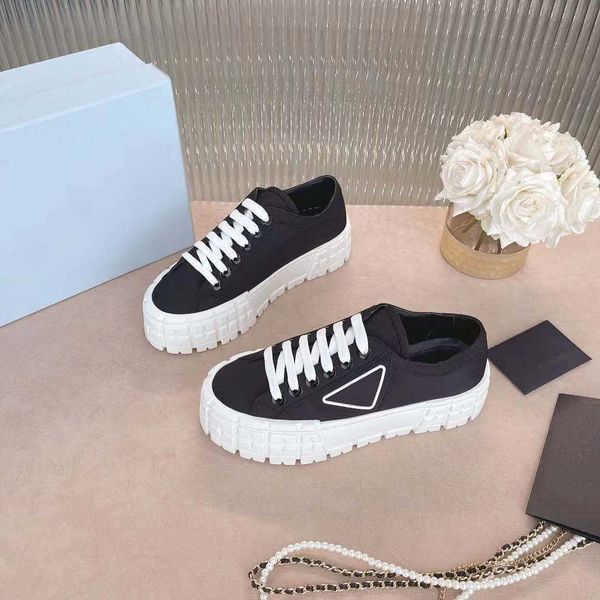 fashion rubber platform inspired by motocross tires defines women shoes design of these nylon gabardine sneakers. the triangle decorate50, Black
fashion rubber platform inspired by motocross tires defines women shoes design of these nylon gabardine sneakers. the triangle decorate50, Black