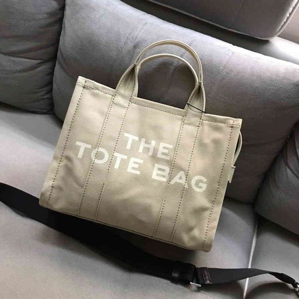 new women's shopping tote bag mj canvas cowhide portable single shoulder bag with zipper designers y220326
new women's shopping tote bag mj canvas cowhide portable single shoulder bag with zipper designers y220326