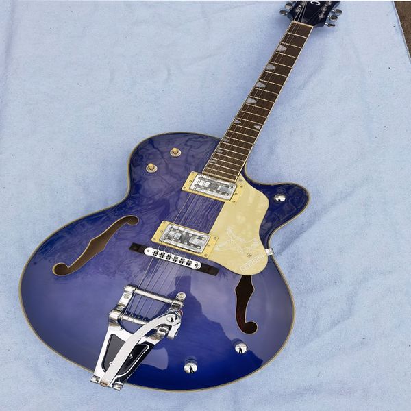 cool purple 6-string electric guitar with vibrato hollow panel good feel and sound quality it can be customized by mail 
cool purple 6-string electric guitar with vibrato hollow panel good feel and sound quality it can be customized by mail
