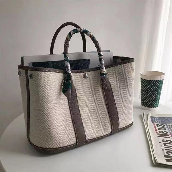 h logo 2022 garden party bag large capacity new canvas with cowhide head bag casual handbag one-shoulder color slant tote bag257d
h logo 2022 garden party bag large capacity new canvas with cowhide head bag casual handbag one-shoulder color slant tote bag257d