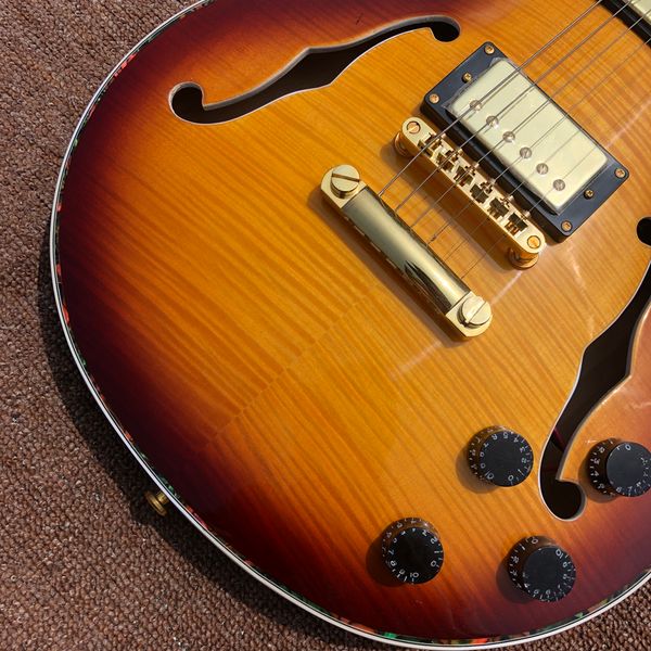 2022flower inlaid abalone fingerboard electric guitar, maple double f hollow body electric guitarsame of picture
2022flower inlaid abalone fingerboard electric guitar, maple double f hollow body electric guitarsame of picture