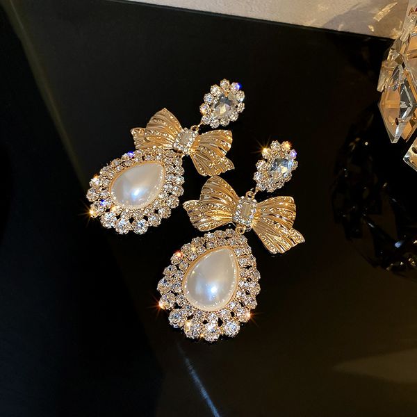 925 silver needle korean elegant pearl diamond bow earrings water drop trendy court style socialite elegant stud earring, Golden
925 silver needle korean elegant pearl diamond bow earrings water drop trendy court style socialite elegant stud earring, Golden