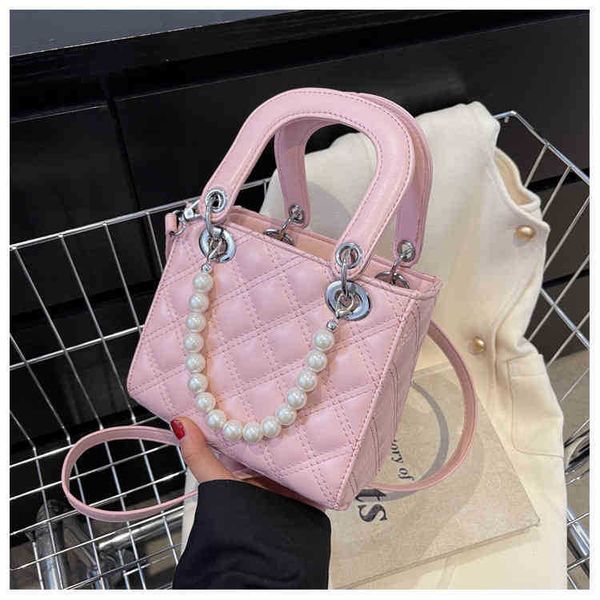 2022 new simple color pearl handbag hand-held single shoulder cross trend women's bag wholesale western style ladies designer bags
2022 new simple color pearl handbag hand-held single shoulder cross trend women's bag wholesale western style ladies designer bags
