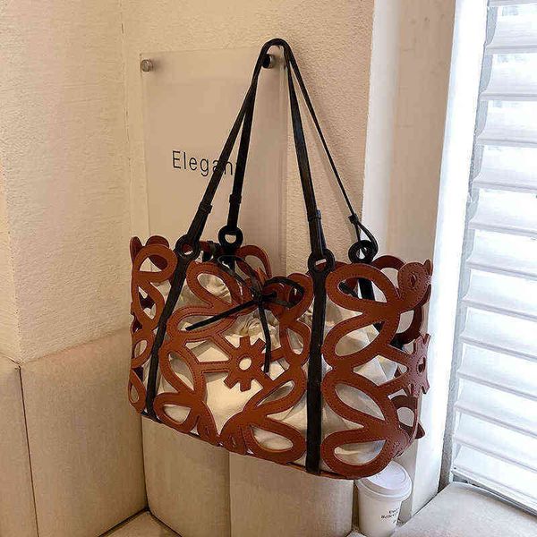 large capacity one shoulder women s bag summer niche all match hollow child mother tote bag 2205010
large capacity one shoulder women s bag summer niche all match hollow child mother tote bag 2205010