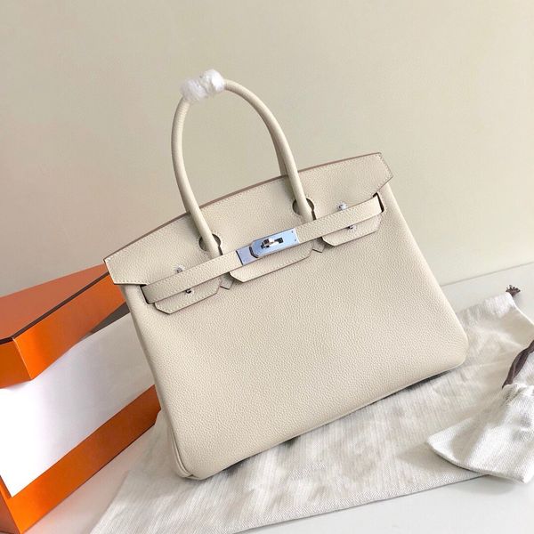 25cm handmade quality totes togo leather bag brand purse wax line stitching silver or gold hardware women handbag red carie green colors
25cm handmade quality totes togo leather bag brand purse wax line stitching silver or gold hardware women handbag red carie green colors