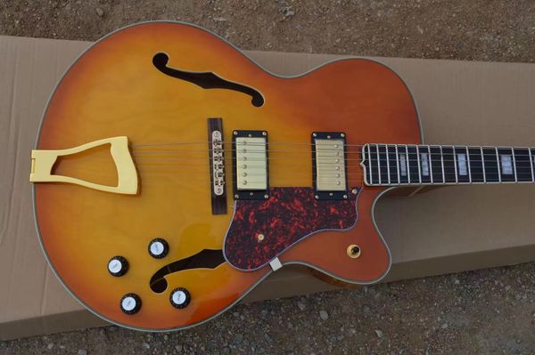 wholesale jazz electric guitar semi-hollow body material maple gold plated with red pick gurad color orange
wholesale jazz electric guitar semi-hollow body material maple gold plated with red pick gurad color orange