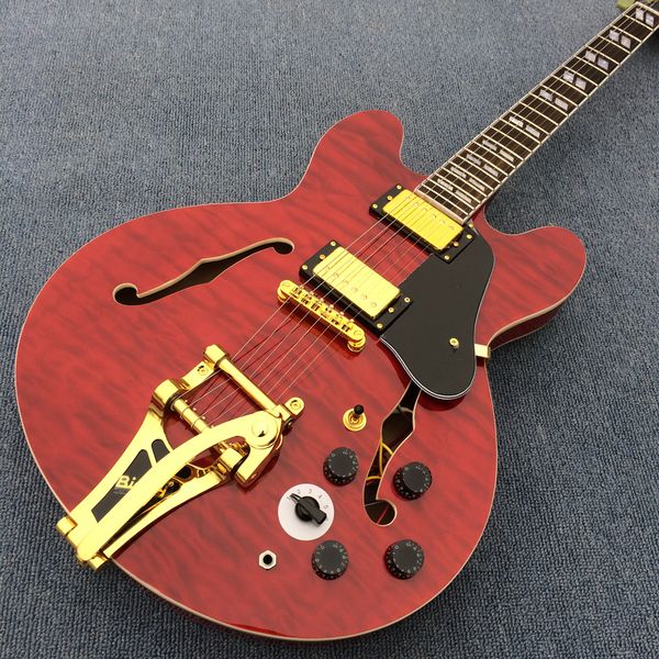 delivery, electric guitar, red flame maple jazz guitar, gold hardware with tremolo system
delivery, electric guitar, red flame maple jazz guitar, gold hardware with tremolo system