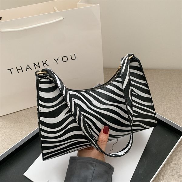 fashion zebra print women luxury handbag pu leather simple underarm shoulder bag female daily design pouch 220707
fashion zebra print women luxury handbag pu leather simple underarm shoulder bag female daily design pouch 220707