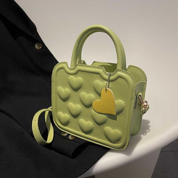 2022 new fashion women's handbag solid color love peach design small bag messenger temperament trend bag versatile
2022 new fashion women's handbag solid color love peach design small bag messenger temperament trend bag versatile