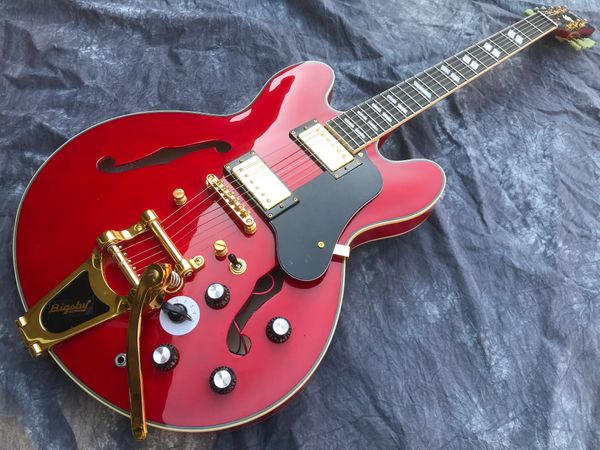 red semi-hollow jazz electric guitar gold hardware tremolo 
red semi-hollow jazz electric guitar gold hardware tremolo