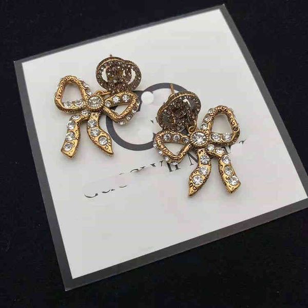 i bow earring design double interlocking classic matching earrings made of brass jewelry sale, Golden
i bow earring design double interlocking classic matching earrings made of brass jewelry sale, Golden
