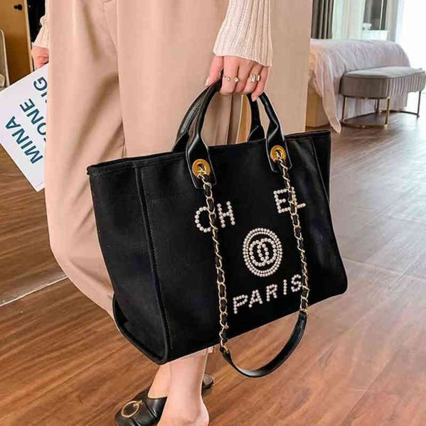 luxury fashion classic beach bags tote label pearl evening bag portable large capacity female designer canvas handbag brand women handbags l 
luxury fashion classic beach bags tote label pearl evening bag portable large capacity female designer canvas handbag brand women handbags l