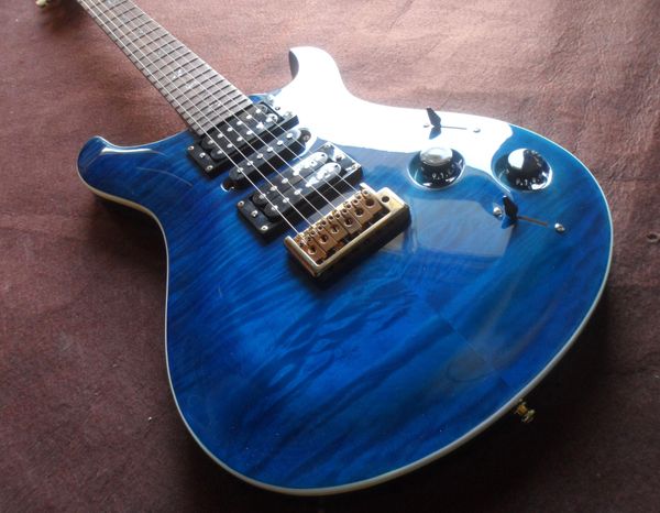 blue prs electric guitar neck through body a flame maple inlays birds gold hardware
blue prs electric guitar neck through body a flame maple inlays birds gold hardware