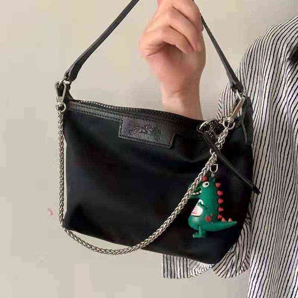 2021 new dragon bag solid color underarm women's oxford cloth small square embroidered horse mini portable single shoulder
2021 new dragon bag solid color underarm women's oxford cloth small square embroidered horse mini portable single shoulder