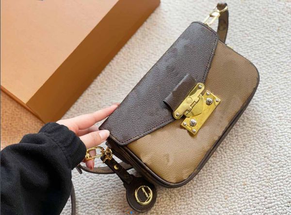 swing womens handbag pochette show leather bag designer cross body elongated shoulder bag with removable circle charm iconic s-lock closure
swing womens handbag pochette show leather bag designer cross body elongated shoulder bag with removable circle charm iconic s-lock closure