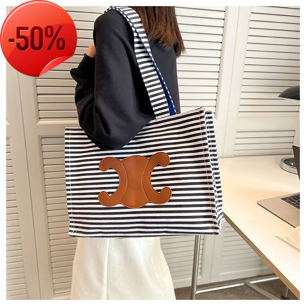 factory directly new fashion summer arc de triomphe armpit zebra stripe large capacity bag portable shopping bag designer bags
factory directly new fashion summer arc de triomphe armpit zebra stripe large capacity bag portable shopping bag designer bags