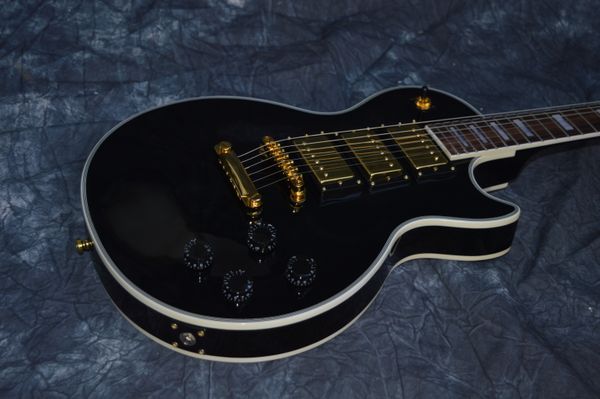 chinese electric guitar les custom black color 3 pickups gold hardware 6 strings mahogany body and neck
chinese electric guitar les custom black color 3 pickups gold hardware 6 strings mahogany body and neck