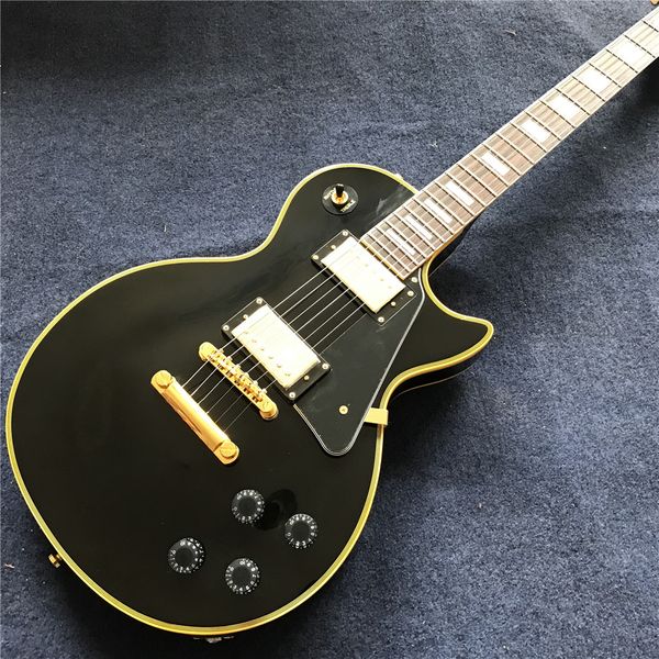 new arrival custom black electric guitar with yellow binding and logo , rosewood fingerboard , gold color hardware, high quality
new arrival custom black electric guitar with yellow binding and logo , rosewood fingerboard , gold color hardware, high quality