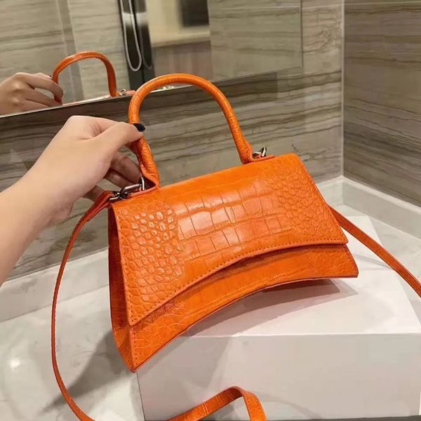 shopping bag fashion designer handbag lady carries a classic retro wallet with a half moon shape of luxury leather over the shoulder
shopping bag fashion designer handbag lady carries a classic retro wallet with a half moon shape of luxury leather over the shoulder