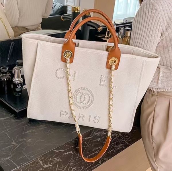 classic fashion luxury beach bags tote label pearl evening bag portable large capacity female designer canvas handbag brand ch women handbag
classic fashion luxury beach bags tote label pearl evening bag portable large capacity female designer canvas handbag brand ch women handbag