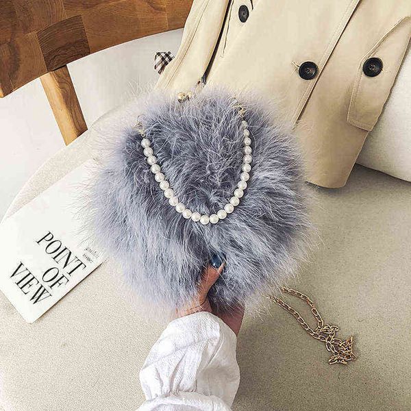 2021 luxury winter pearl beads chain fur plush round evening bags party handbags purses g220420
2021 luxury winter pearl beads chain fur plush round evening bags party handbags purses g220420