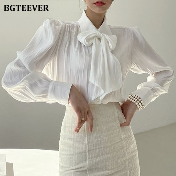 elegant lapel lace-up women white shirts blouses 2021 autumn puff sleeve loose ruched female blusas
elegant lapel lace-up women white shirts blouses 2021 autumn puff sleeve loose ruched female blusas