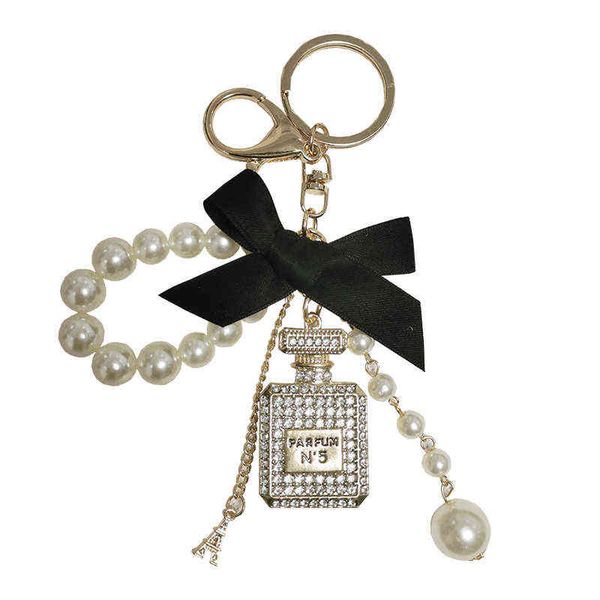 pearl chain bottle keychain for woman luxury jewelry bow car keyring bowknot camellia pearl pendant keychains bag decoration aa220318, Silver
pearl chain bottle keychain for woman luxury jewelry bow car keyring bowknot camellia pearl pendant keychains bag decoration aa220318, Silver