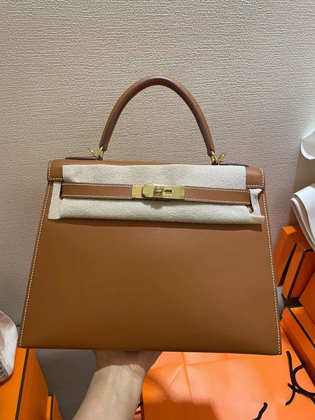 28cm tote barenia leather brand handbag fashion purse fully handmade quality wax line stitching golden hardware fast delivery wholesale
28cm tote barenia leather brand handbag fashion purse fully handmade quality wax line stitching golden hardware fast delivery wholesale