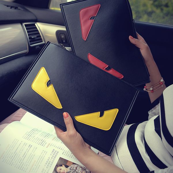 Woman little monster cartoon fashion phone envelope bag hand shoulder messenger bag
Woman little monster cartoon fashion phone envelope bag hand shoulder messenger bag