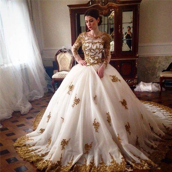 sparkly ball gown wedding dresses beaded gold lace appliques illusion long sleeves crew neck zipper up back bridal gowns with court train, White
sparkly ball gown wedding dresses beaded gold lace appliques illusion long sleeves crew neck zipper up back bridal gowns with court train, White