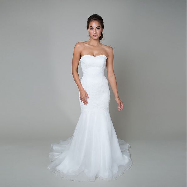 trumpet style wedding gown features a dropped waist a sweetheart neckline a flowing organza skirt and corded lace bridal dress, White
trumpet style wedding gown features a dropped waist a sweetheart neckline a flowing organza skirt and corded lace bridal dress, White