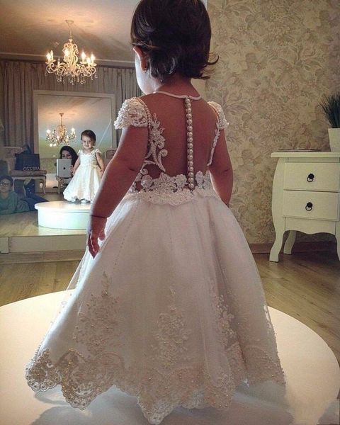 Lovely Arabic Toddle Little Girls Princess Flower Girl Dresses Kids Sheer Backless Cap Sleeves Tea Length Appliqued Beaded Pageant Gowns
Lovely Arabic Toddle Little Girls Princess Flower Girl Dresses Kids Sheer Backless Cap Sleeves Tea Length Appliqued Beaded Pageant Gowns