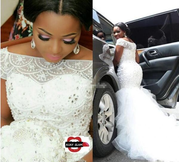 plus size arabic nigerian wedding dresses luxury beading pearls sheer bateau neck short sleeves chapel train tulle 2017 mermaid bridal gowns, White
plus size arabic nigerian wedding dresses luxury beading pearls sheer bateau neck short sleeves chapel train tulle 2017 mermaid bridal gowns, White