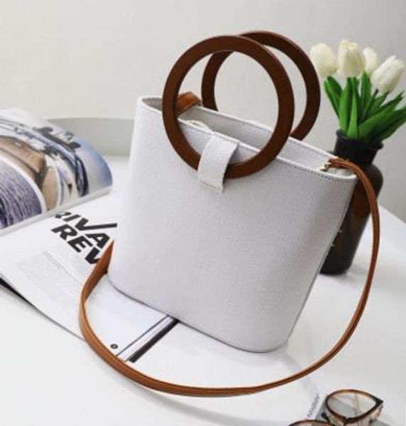 wooden ring rope with straw a hand bill of lading for the shoulder versatile plain bag straw beach bag handbags
wooden ring rope with straw a hand bill of lading for the shoulder versatile plain bag straw beach bag handbags