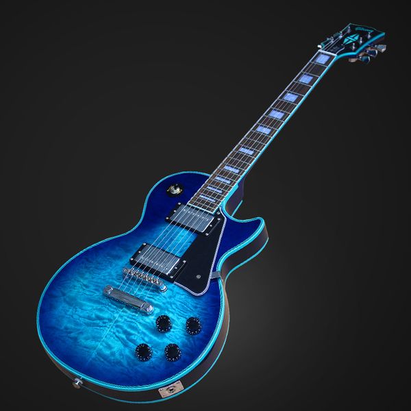 a blue celluloid guitar with water ripple on the casse panel mahogany rosewood mahogany on the back side
a blue celluloid guitar with water ripple on the casse panel mahogany rosewood mahogany on the back side