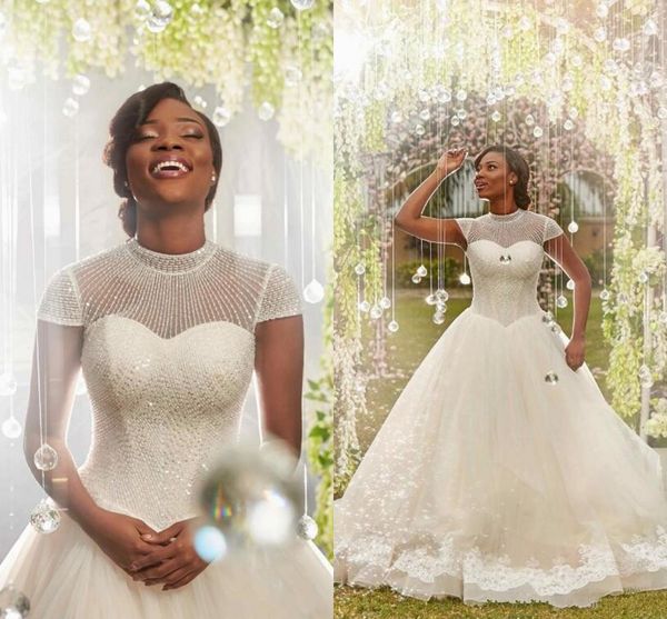 2018 african high collar a line wedding dresses capped sleeves crystals beading tulle appliqued lace white wedding bridal gowns
2018 african high collar a line wedding dresses capped sleeves crystals beading tulle appliqued lace white wedding bridal gowns