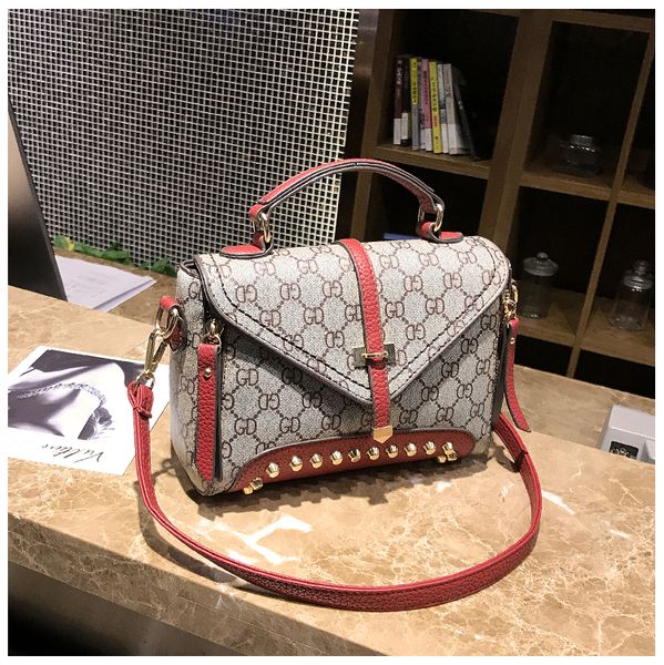 Women Rivet Leather Handbags Famous Brands Handbag Messenger Small Bags Shoulder Bag Tassen Sac a Main 2017 Fashion Borse Tote
Women Rivet Leather Handbags Famous Brands Handbag Messenger Small Bags Shoulder Bag Tassen Sac a Main 2017 Fashion Borse Tote