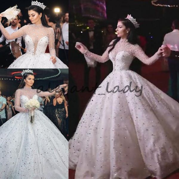 2018 Luxury Glitter Long Sleeve Wedding Dresses Queen Princess Sheer High Neck Crystal Kaftan Dubai Puffy Bridal Wedding Gowns Plus Size
2018 Luxury Glitter Long Sleeve Wedding Dresses Queen Princess Sheer High Neck Crystal Kaftan Dubai Puffy Bridal Wedding Gowns Plus Size