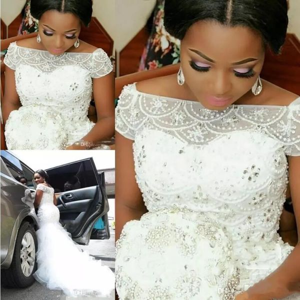 charming arabic nigerian mermaid wedding dresses beading cap sleeve tulle ruffles mermaid bridal gowns plus size custom made wedding dresses, White
charming arabic nigerian mermaid wedding dresses beading cap sleeve tulle ruffles mermaid bridal gowns plus size custom made wedding dresses, White