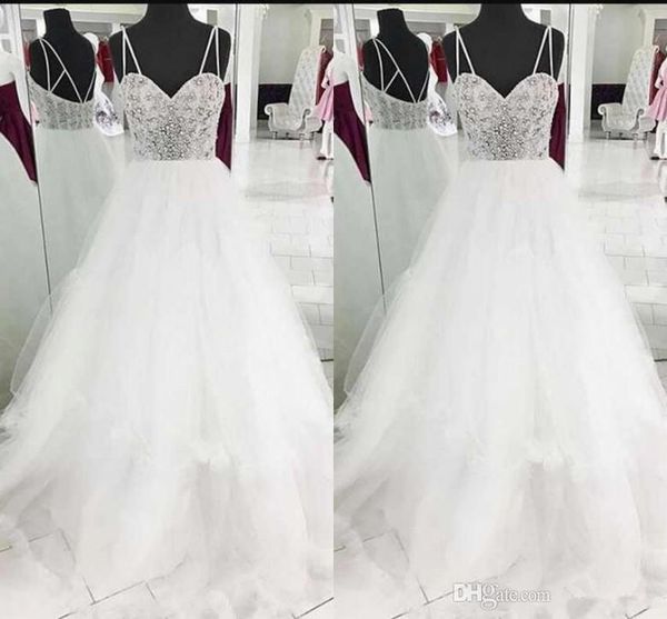 modest white wedding dresses sleeveless spaghetti straps tulle sweep train beaded crystal princess bridal gowns custom made
modest white wedding dresses sleeveless spaghetti straps tulle sweep train beaded crystal princess bridal gowns custom made