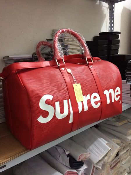 Genuine leather new fa hion men women travel bag duffle bag brand de igner luggage handbag large capacity port bag 45cm
Genuine leather new fa hion men women travel bag duffle bag brand de igner luggage handbag large capacity port bag 45cm