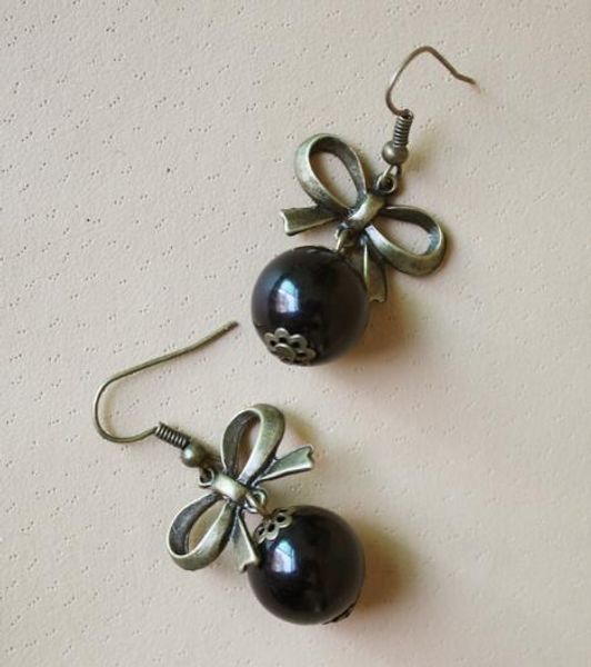 new korean stars with the same style of earrings fashion bow black pearl female fashion classic refined elegant, Silver
new korean stars with the same style of earrings fashion bow black pearl female fashion classic refined elegant, Silver